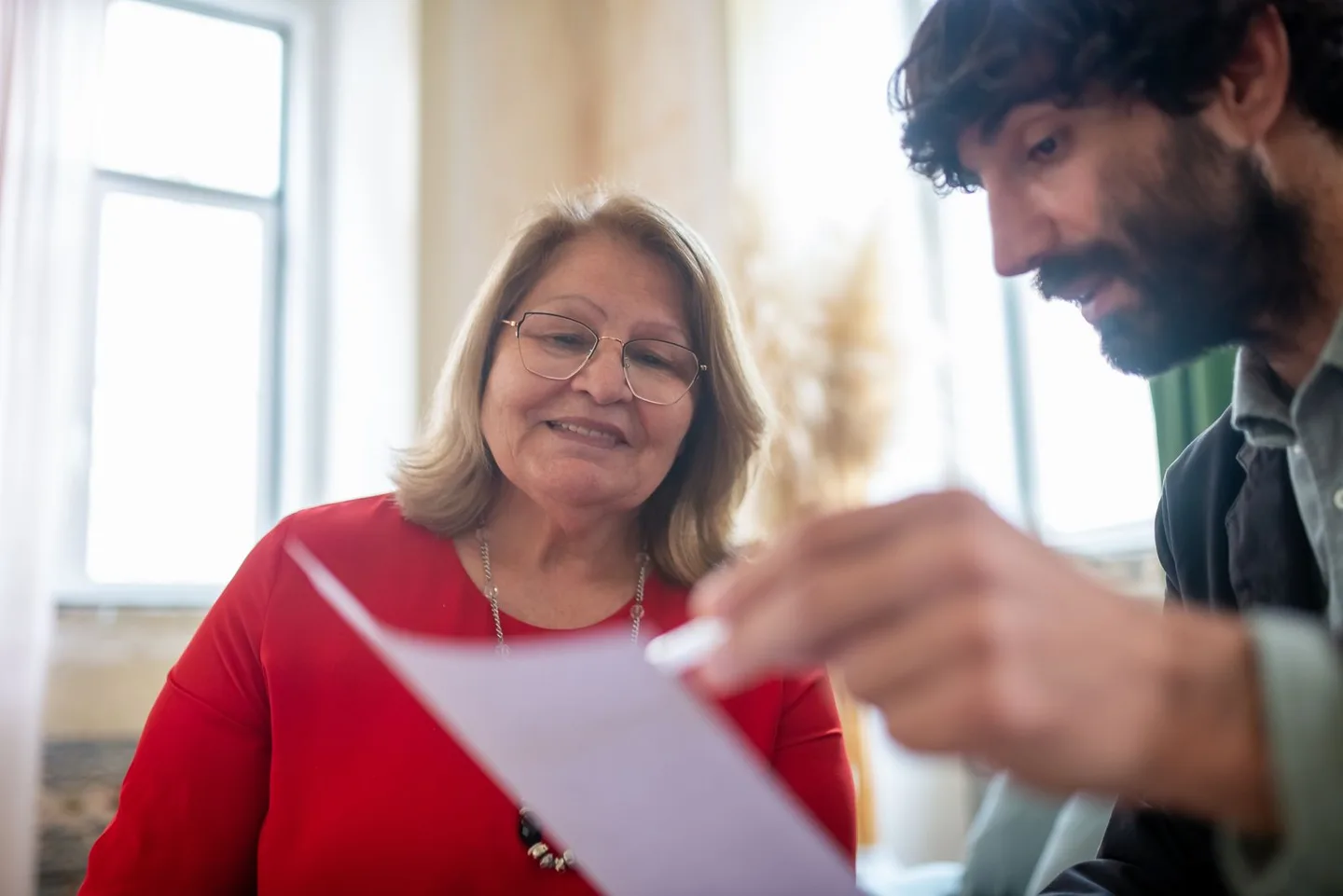 Two people discussing a document together
