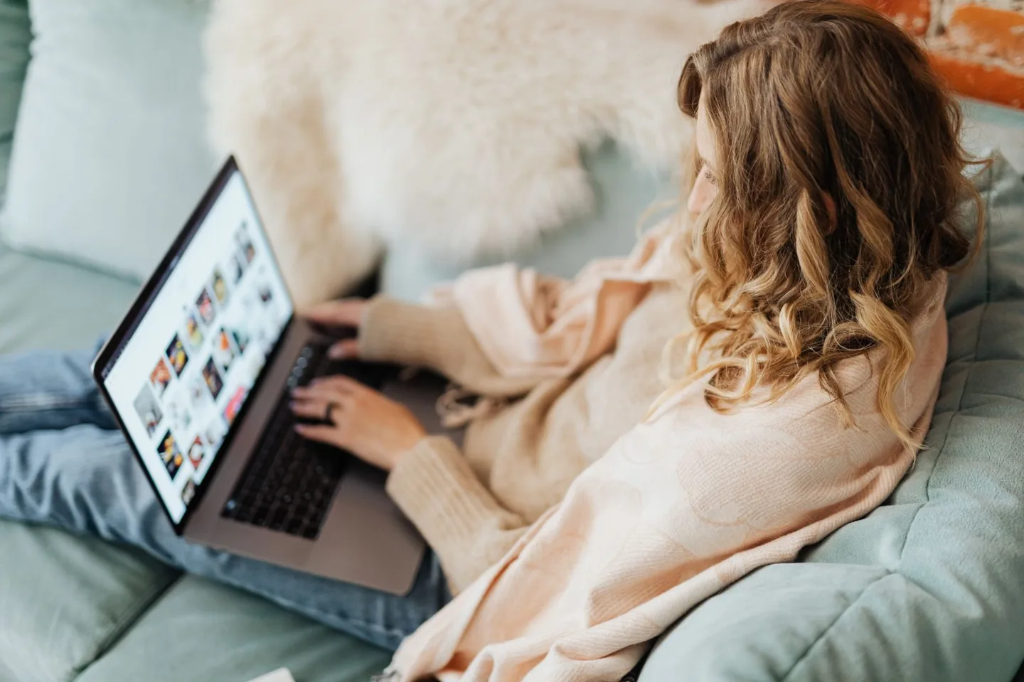 A person using a laptop at home